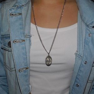 Silver religious mid length necklace